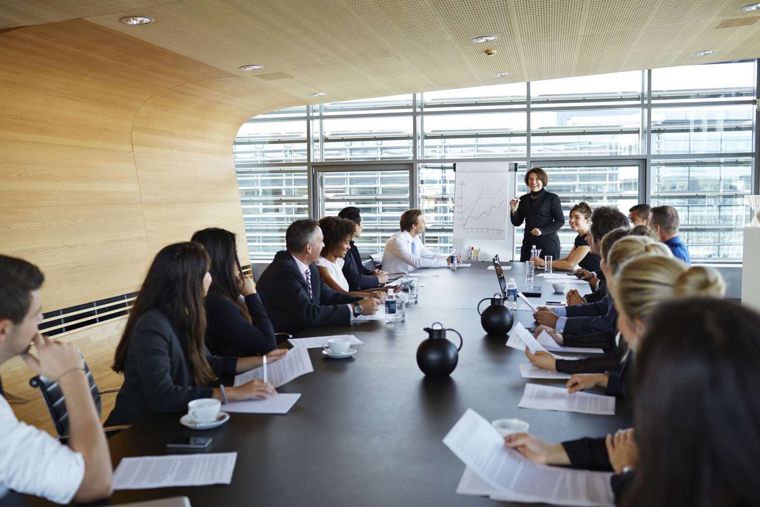 Large meeting of business people in a conference room