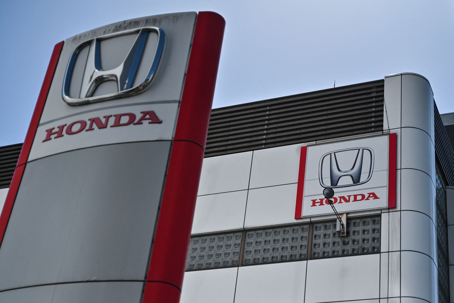 This general view shows signage at a dealership for Japanese auto maker Honda