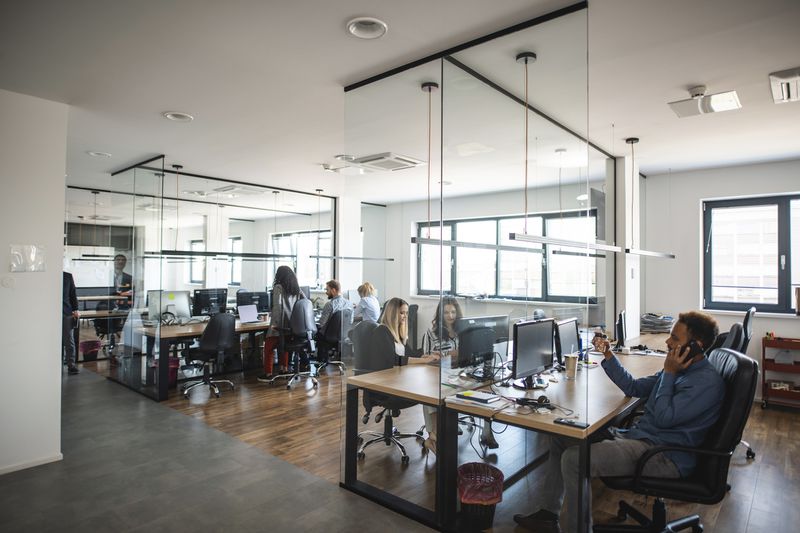 Colleagues working in an open floor plan