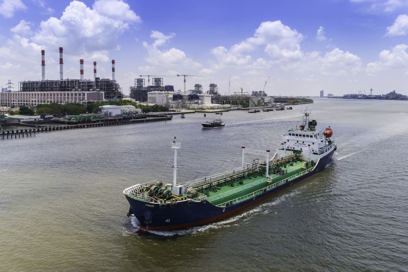 Oil ship tanker in river transportation oil from refinery.
