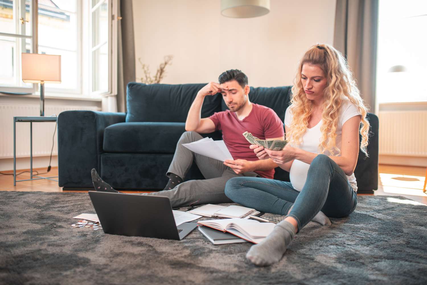 Young couple discussing finances looking frustrated 