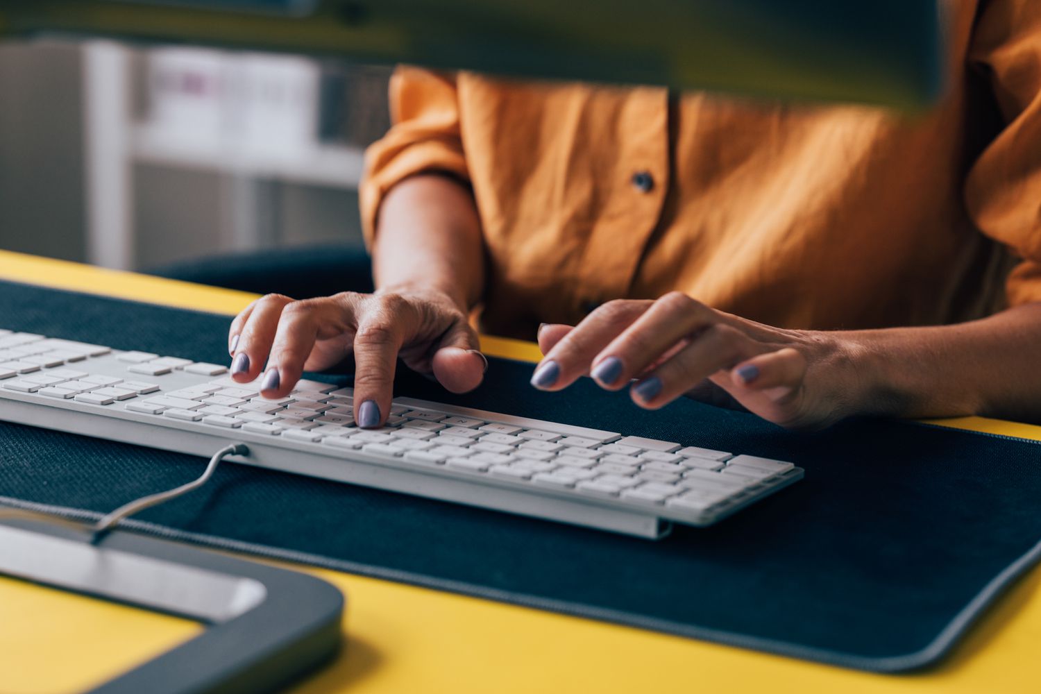 Hands on a computer keyboard