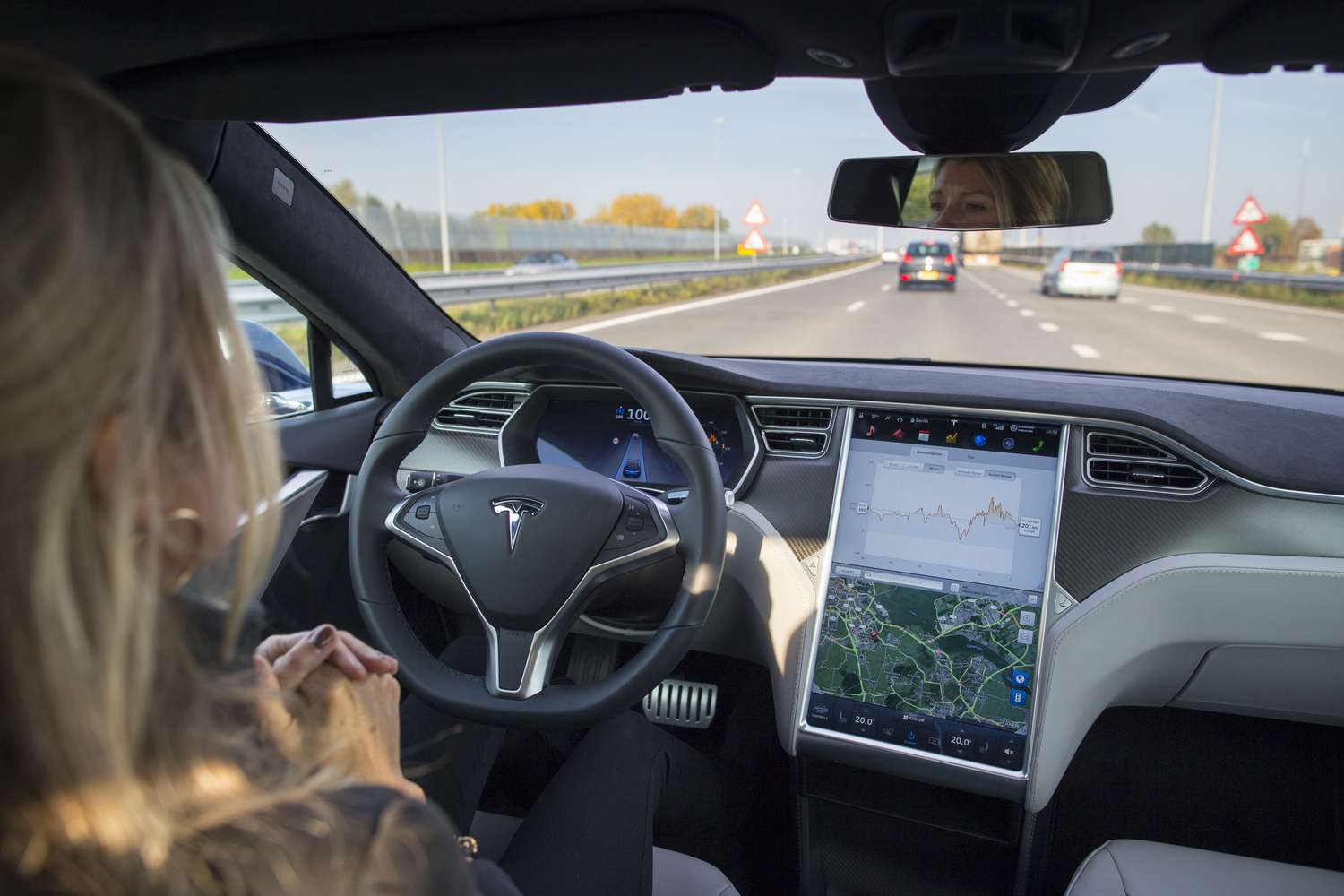 An employee drives a Tesla Motors Inc. Model S electric automobile, equipped with Autopilot hardware and software, hands-free on a highway in Amsterdam, Netherlands, on Monday, Oct. 26, 2015.