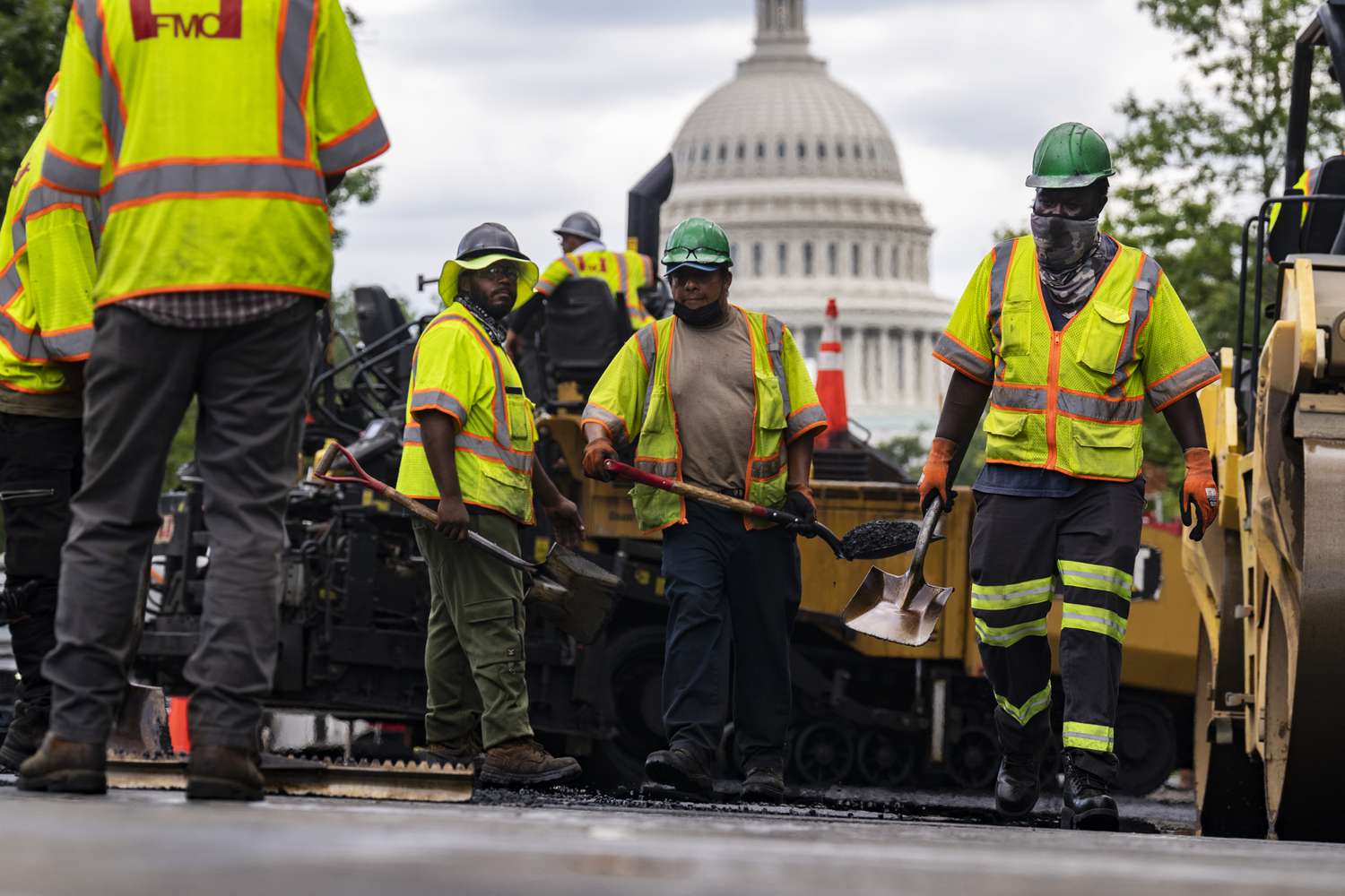 Workers pave a section of North Capitol Street on Thursday, September 8, 2022. 