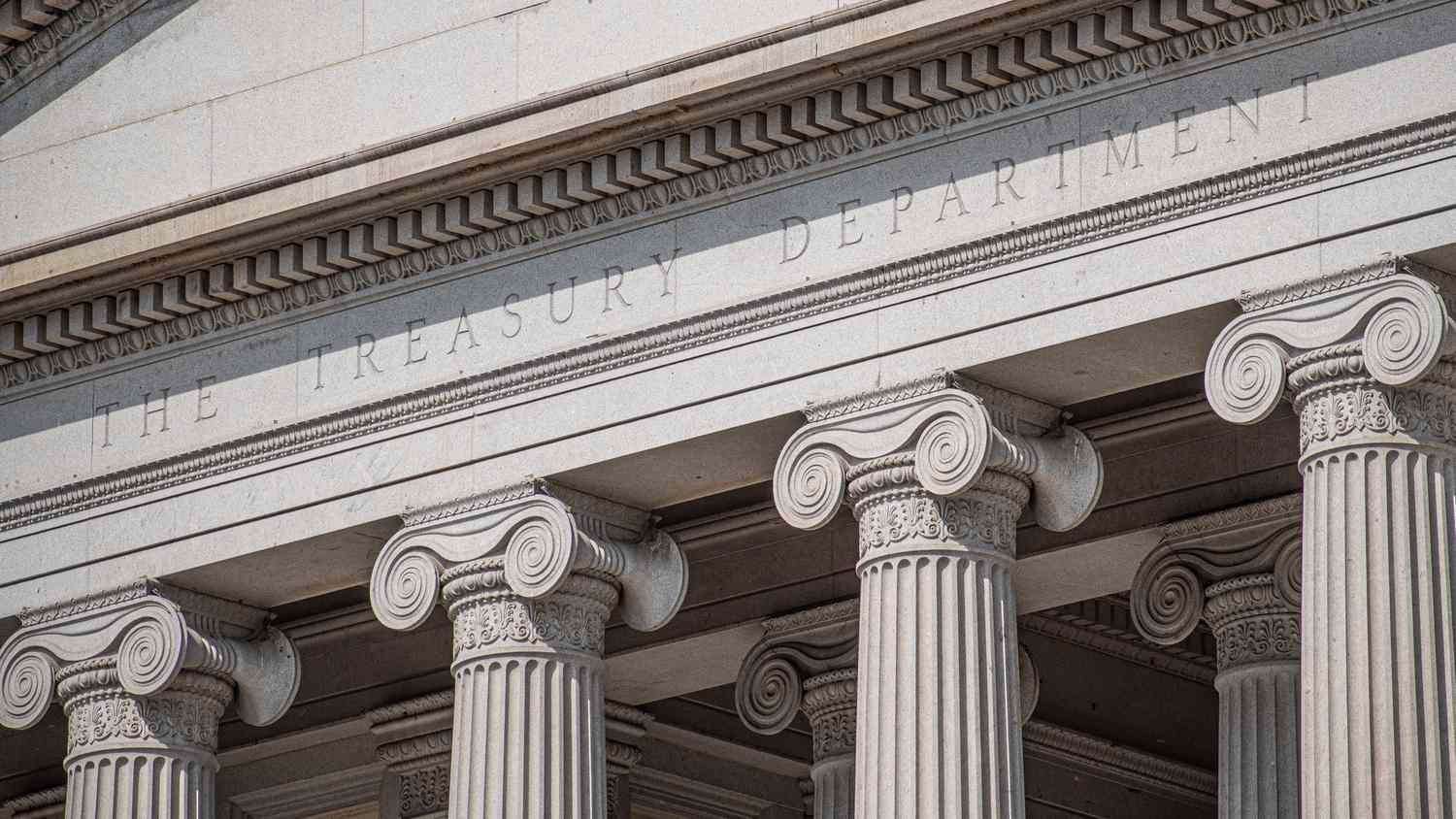 A close-up image of the capital at the top of the columns in front of the U.S. Treasury Department building.