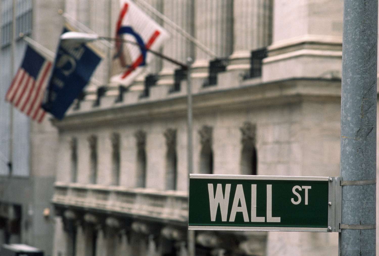 The "Wall St." street sign. 