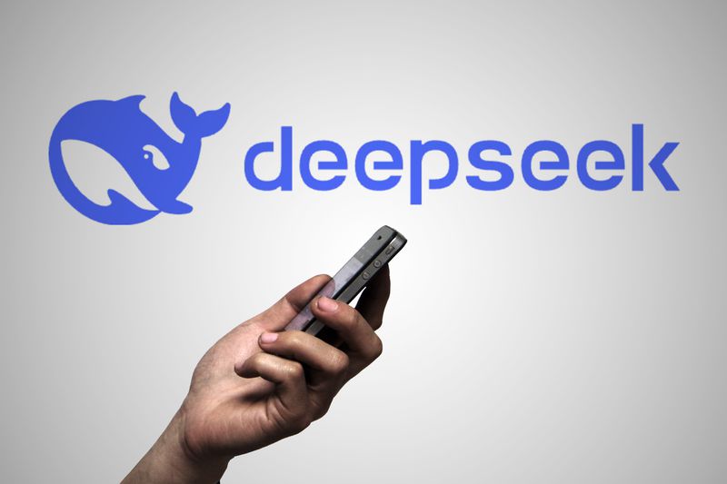 In this photo illustration, a DeepSeek logo is displayed on the backdrop.
