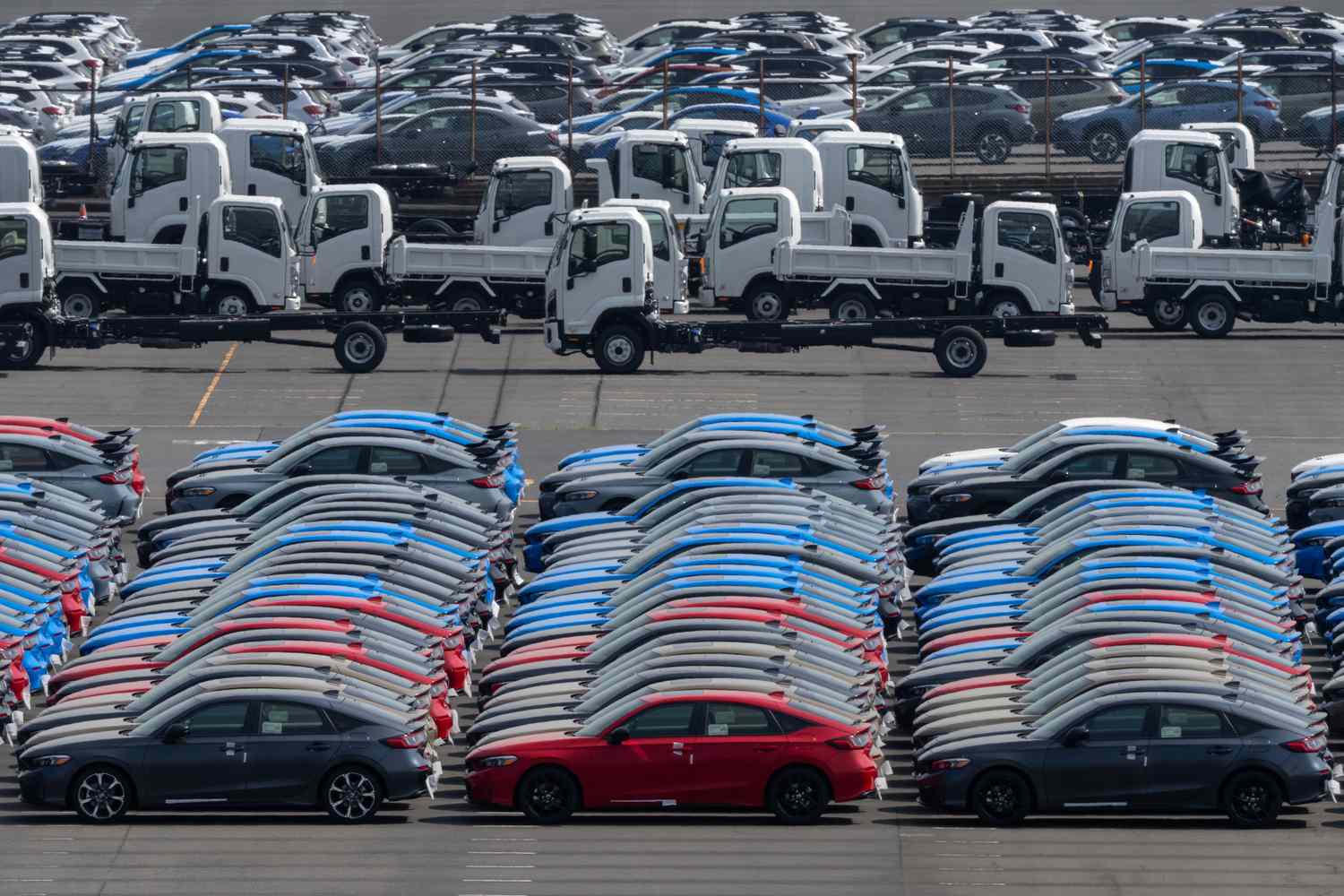 Vehicles awaiting shipment are parked at a port on March 27, 2025 in Yokohama, Japan. U.S. President Donald Trump announced his plan to impose a 25 percent tariff on imported automobiles manufactured outside the United States.