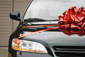 Black car hood with bow on top