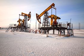 Oil rigs and snow-covered landscape