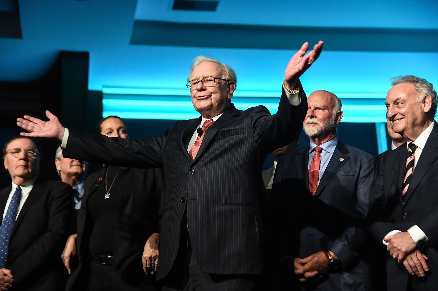 Warren Buffett (C) is joined onstage by 24 other philanthropist and influential business people featured on the Forbes list of 100 Greatest Business Minds.