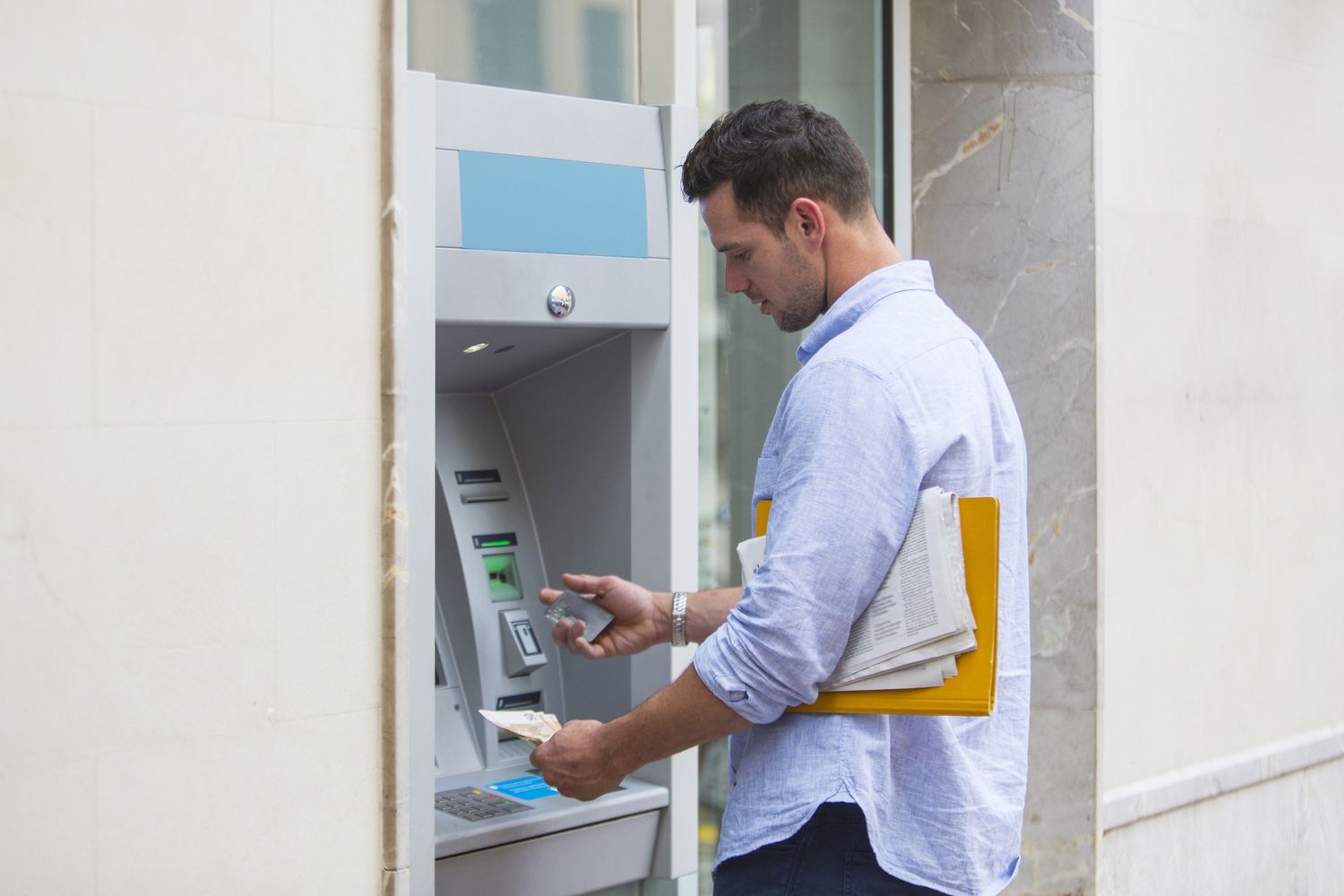 Man withdrawing cash from ATM