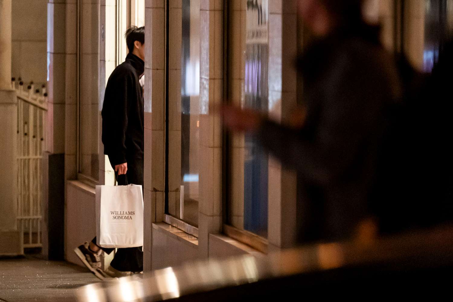 A shopper carries a Williams-Sonoma bag in San Francisco in December. 