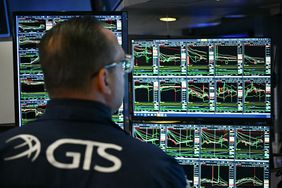 A trader works on the floor of the New York Stock Exchange