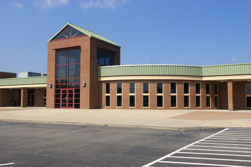 The front of a new public high school building stands ready for the first day of school.