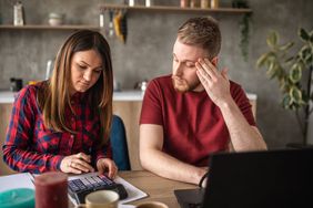 Young couple worries about the negative equity of their house. 