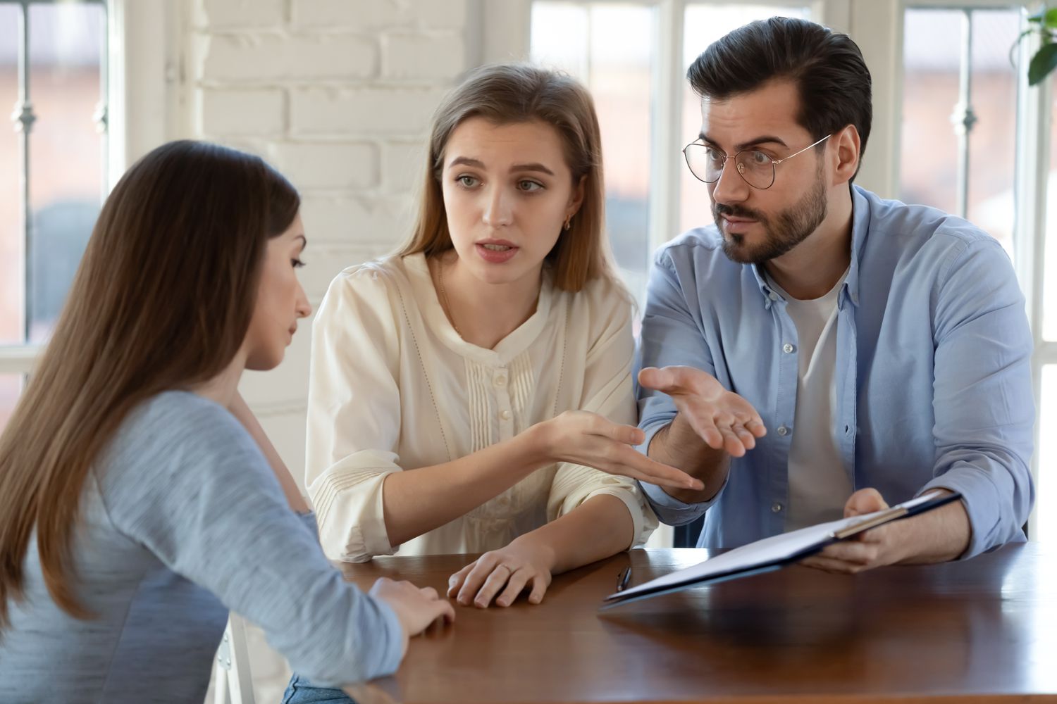 An upset couple push for answers from a financial advisor who misrepresented an investment.