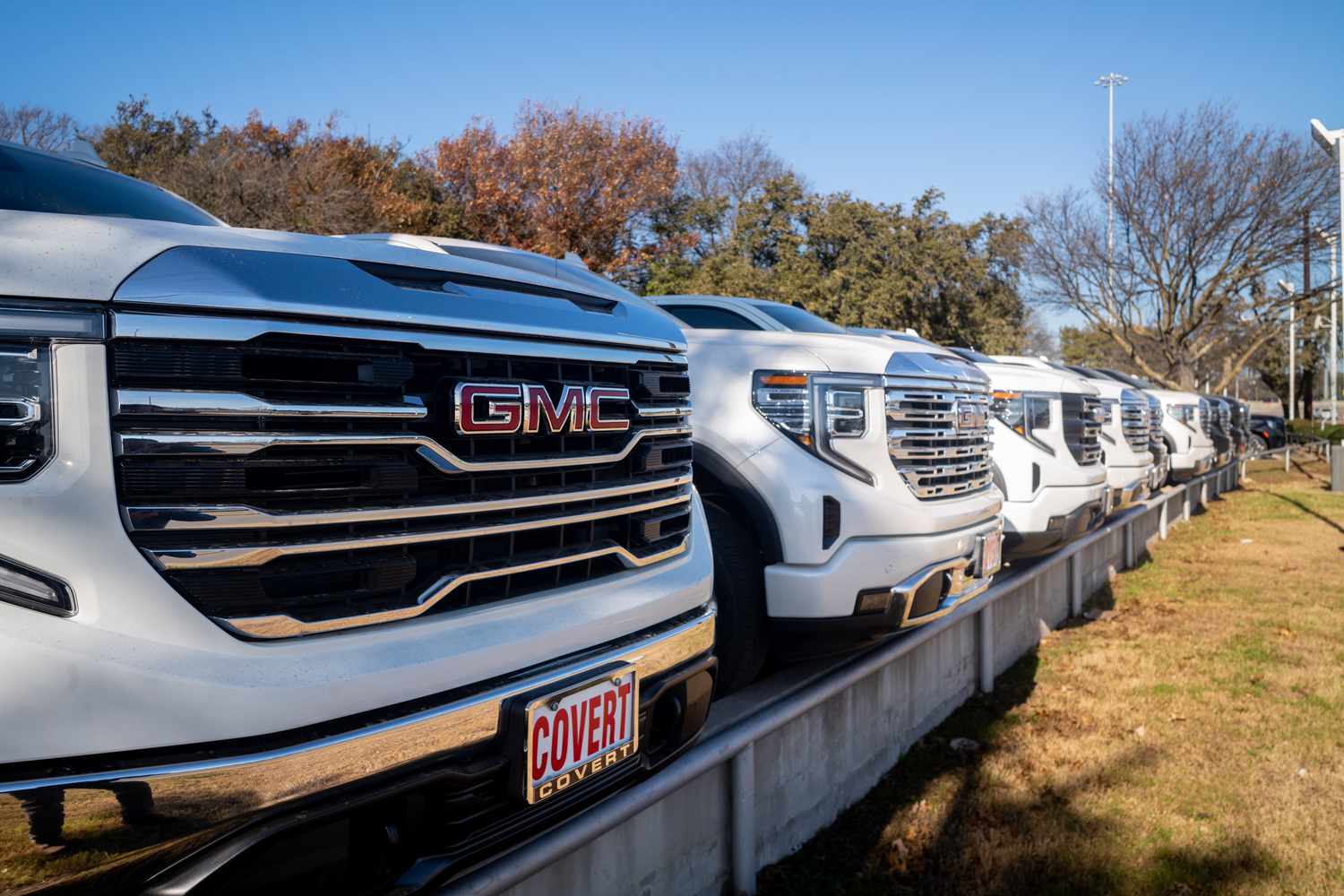 GMC trucks in a General Motors dealership.