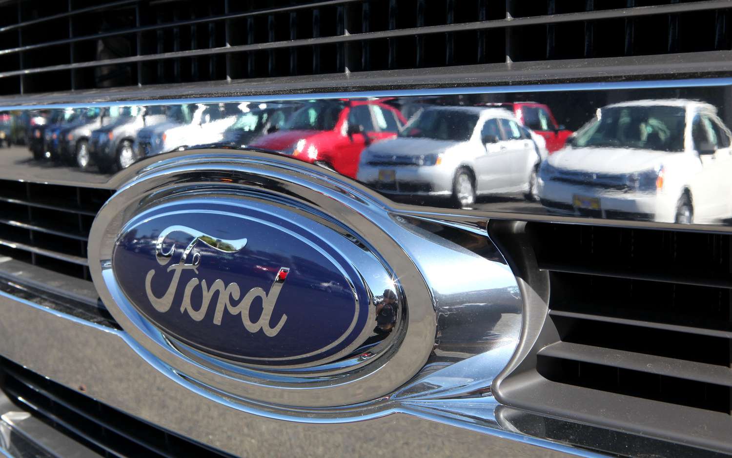 Ford Logo reflecting cars in a parking spot