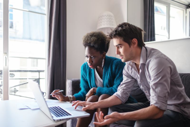 A real estate agent and client review information.