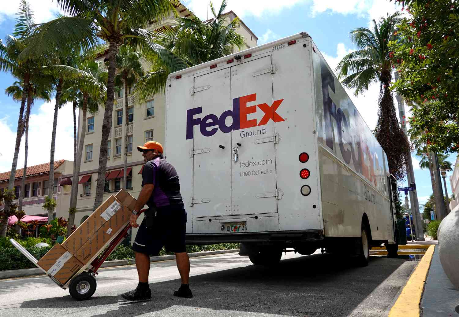 A FedEx worker makes a delivery