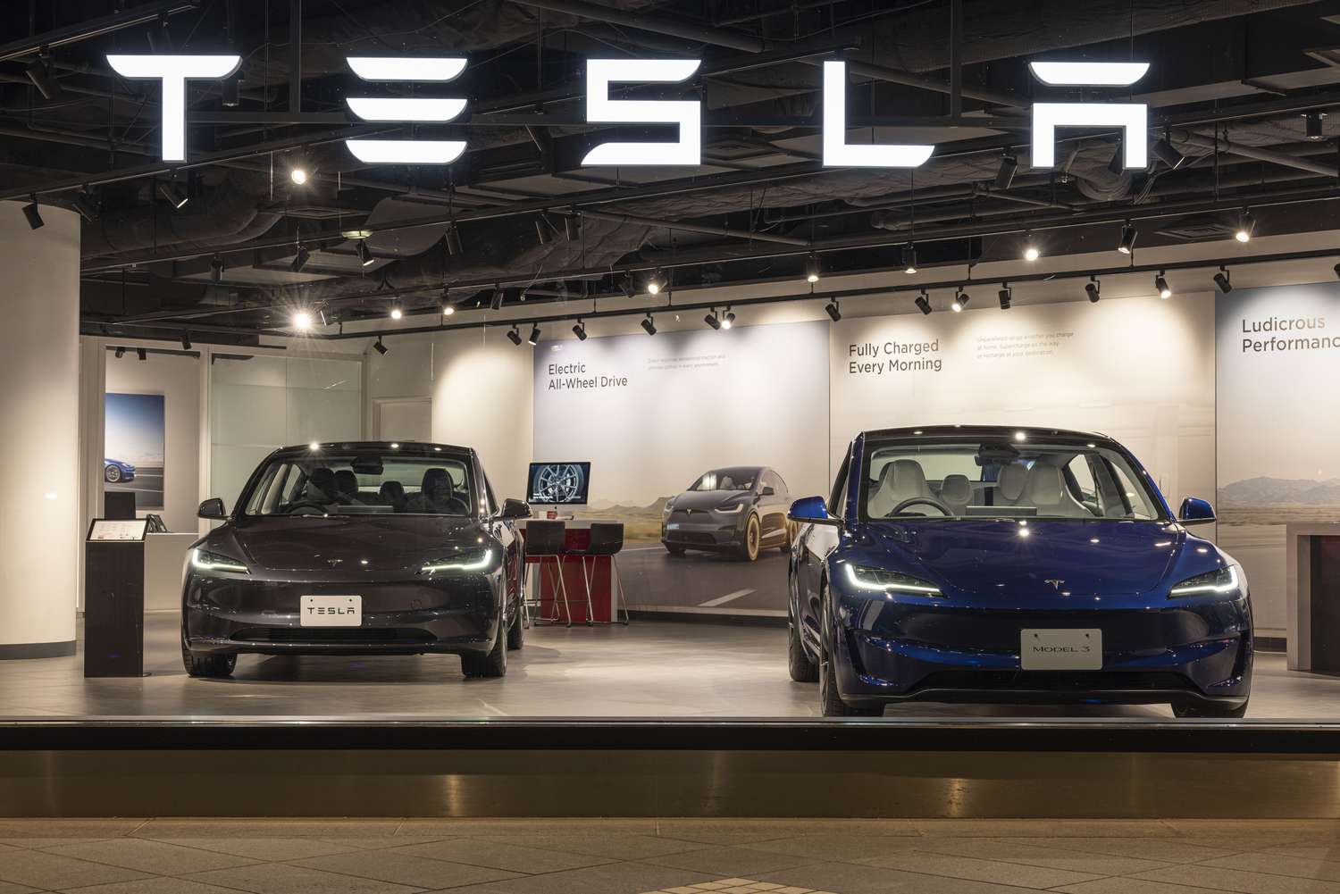 Tesla model Y and model 3 seen on display at a store in Tokyo.