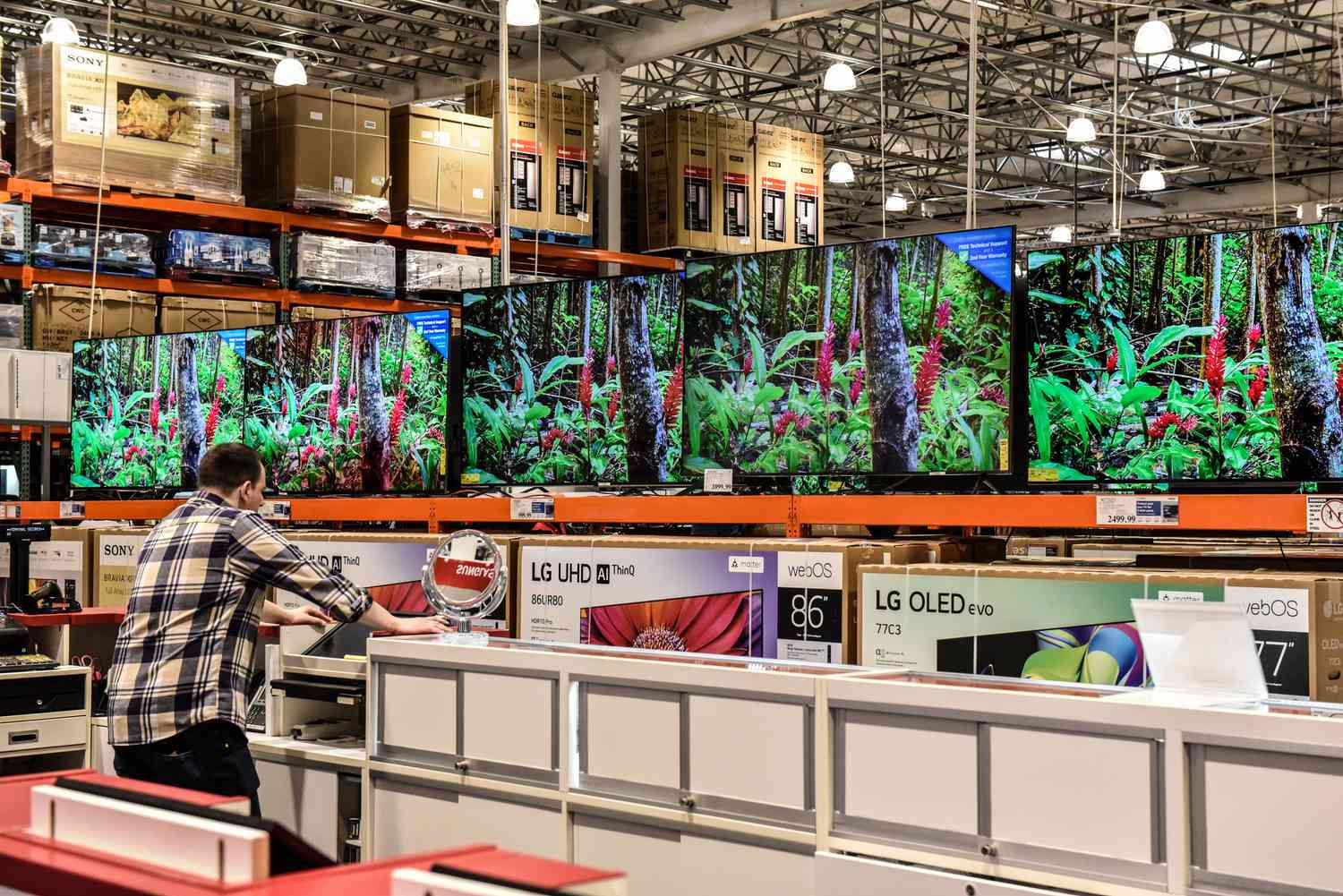 Televisions at a Costco store in Teterboro, New Jersey, US, on Wednesday, Feb. 28, 2024.