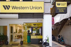 Entrance to a Western Union branch featuring signage for international money transfer services