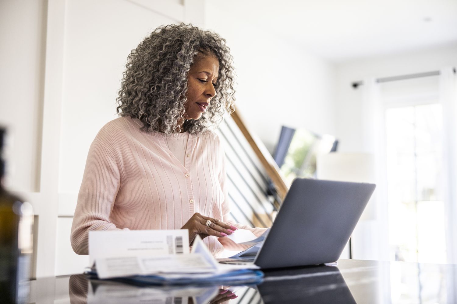 Senior woman looking at her laptop.