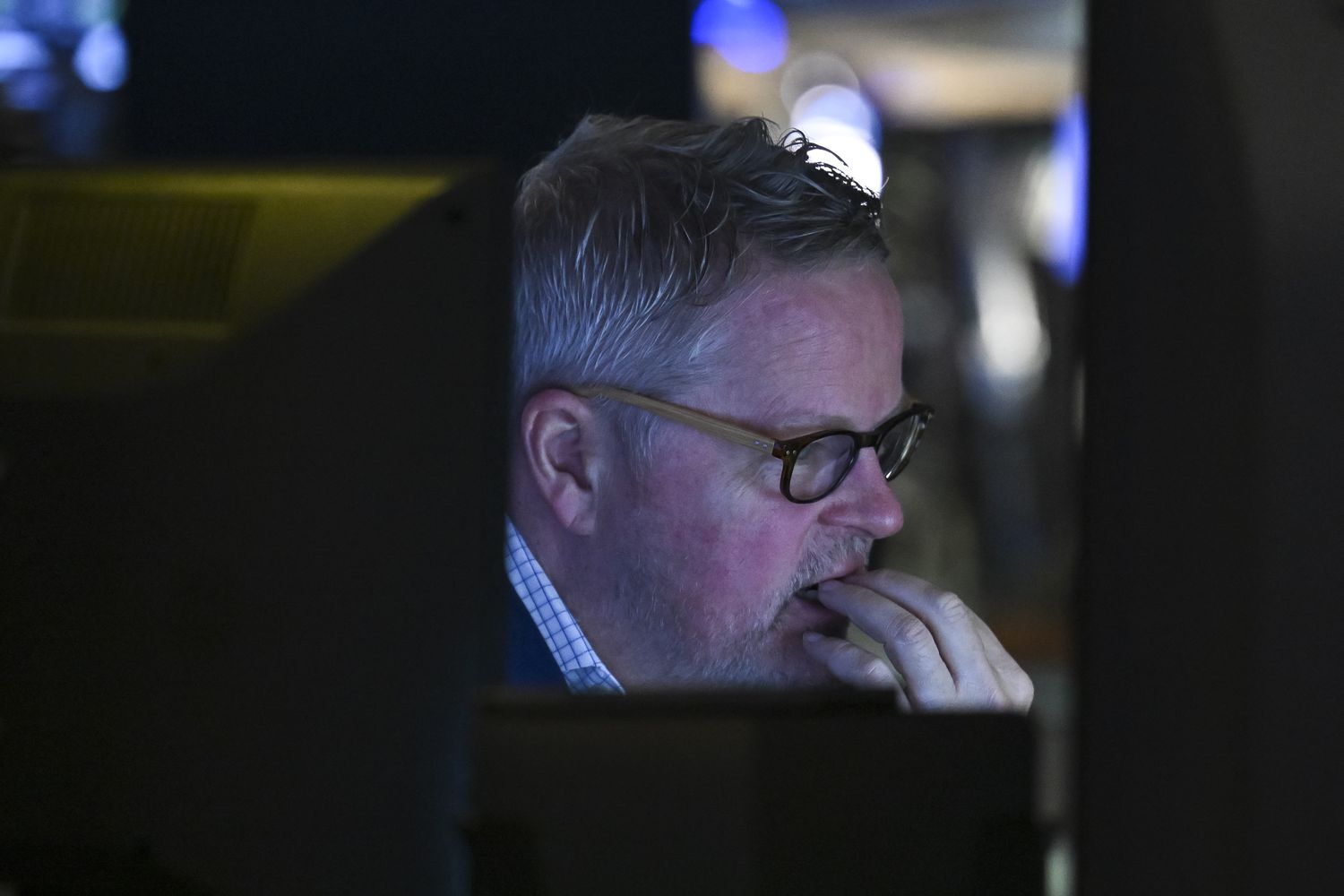 A trader works on the floor of the New York Stock Exchange.