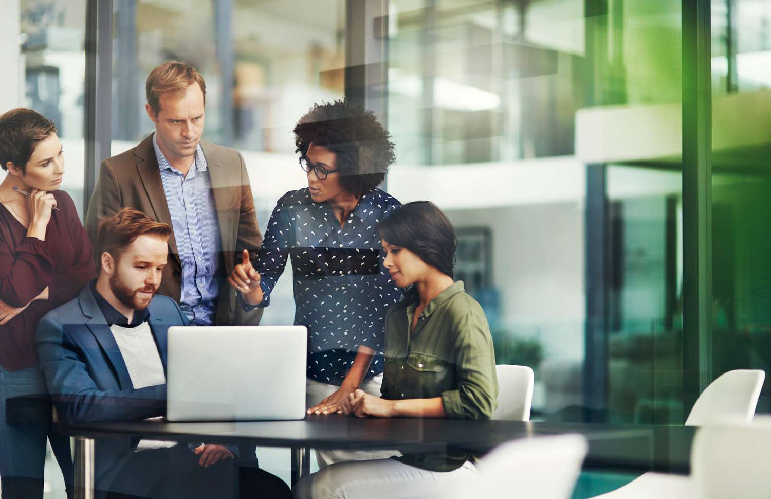 A group of colleagues discussing the difference between Experience and Equifax.