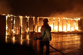Firefighters continue battling the Palisades Fire as flames rage across Los Angeles on Jan. 9, 2025