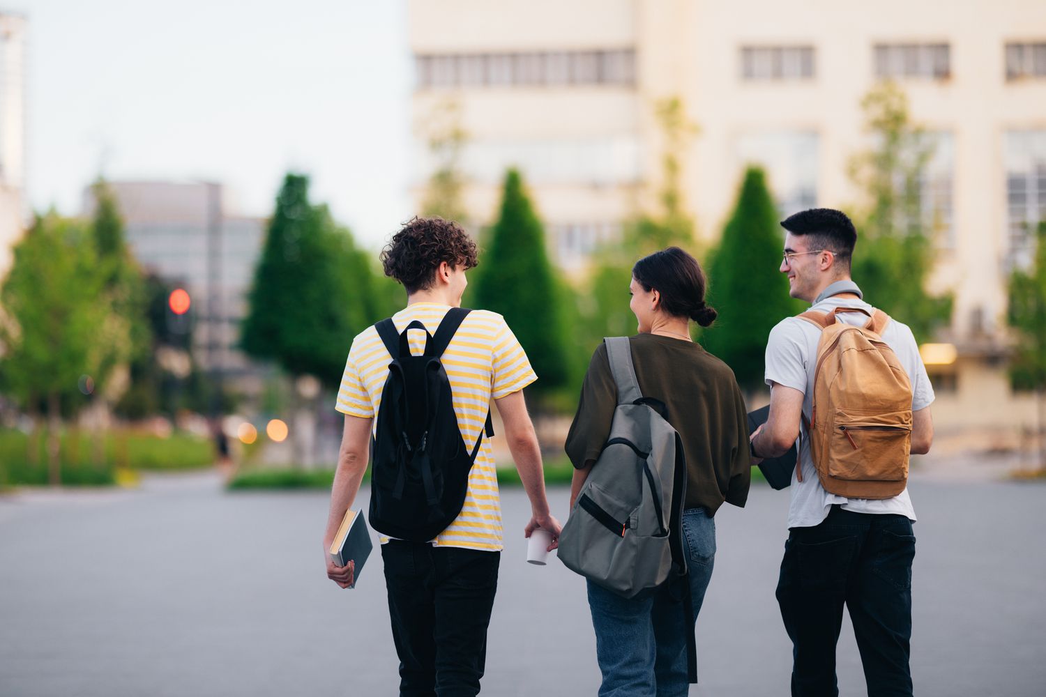 Three students walking outdoors