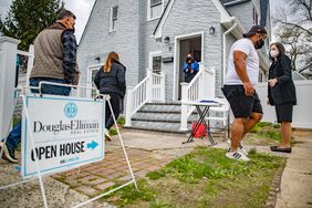 Open house for a home for sale with potential buyers in the foreground.
