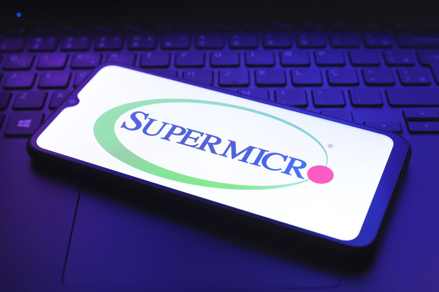The Super Micro Computer logo on a smartphone screen