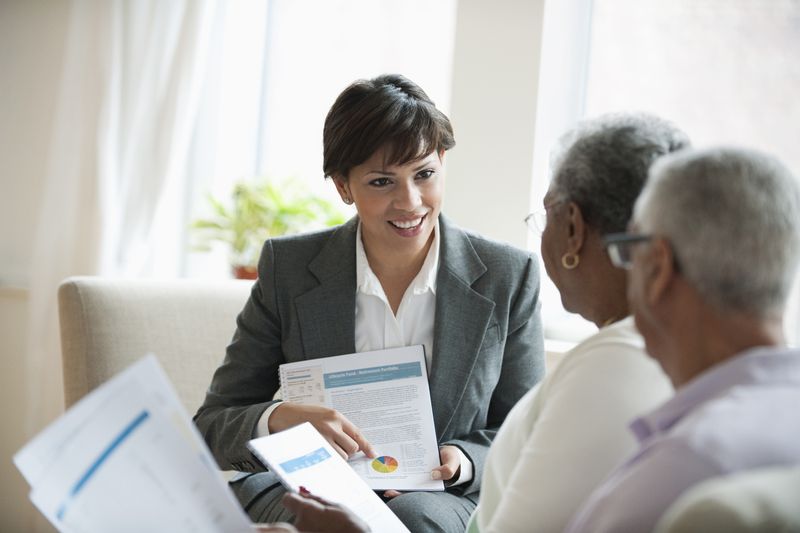 A financial advisor meets with clients to discuss retirement plans