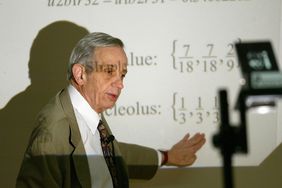 Nobel prize-winning mathematics genius John Nash of Princeton University works through his notes on game theory at the University of Hong Kong. 18 February 2003 