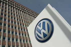 The company logo of automaker Volkswagen AG stands outside Volkswagen headquarters.