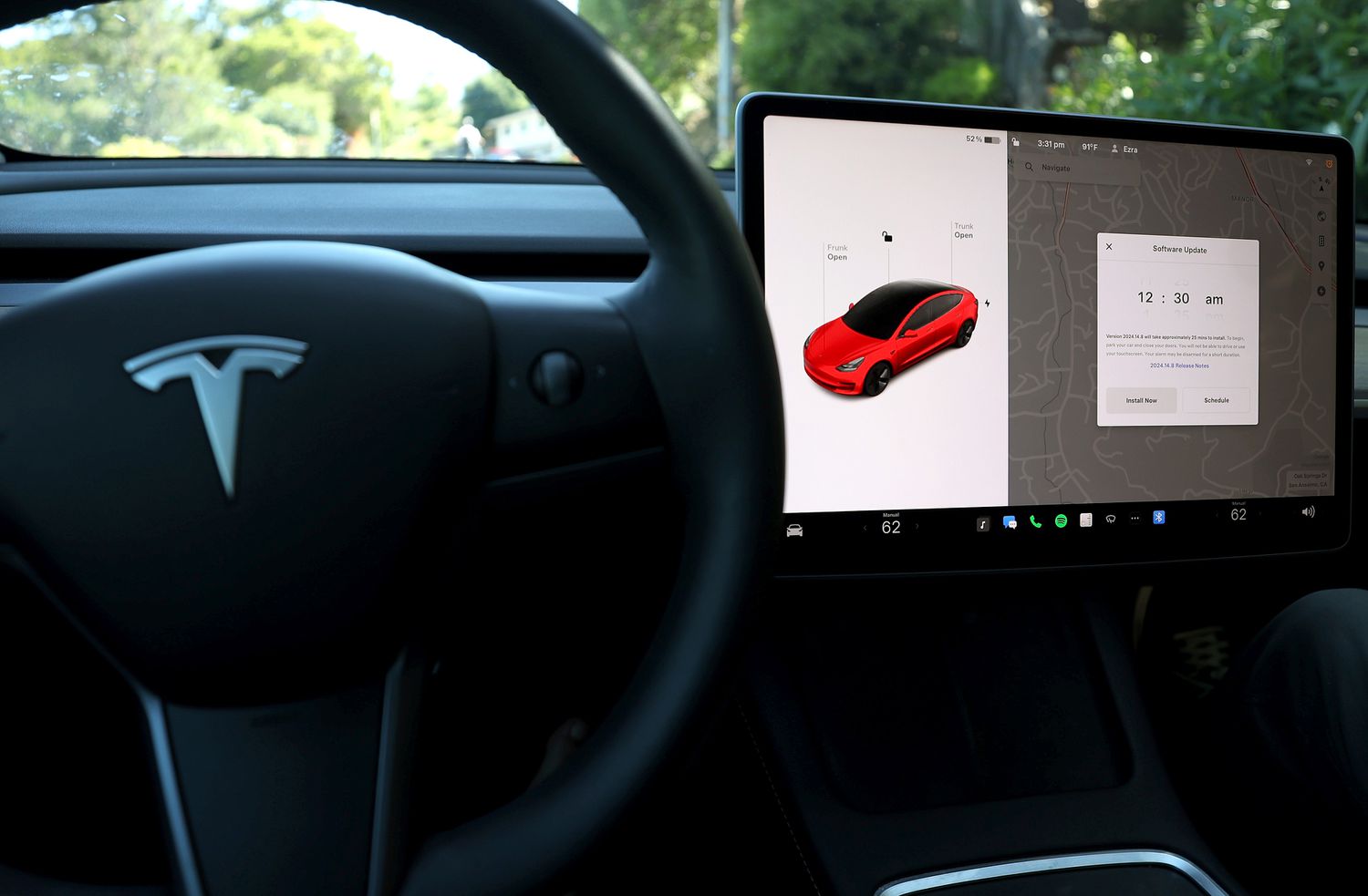 A software update alert appears on the screen of a Tesla Model 3 car on May 31, 2024 in San Anselmo, California. 