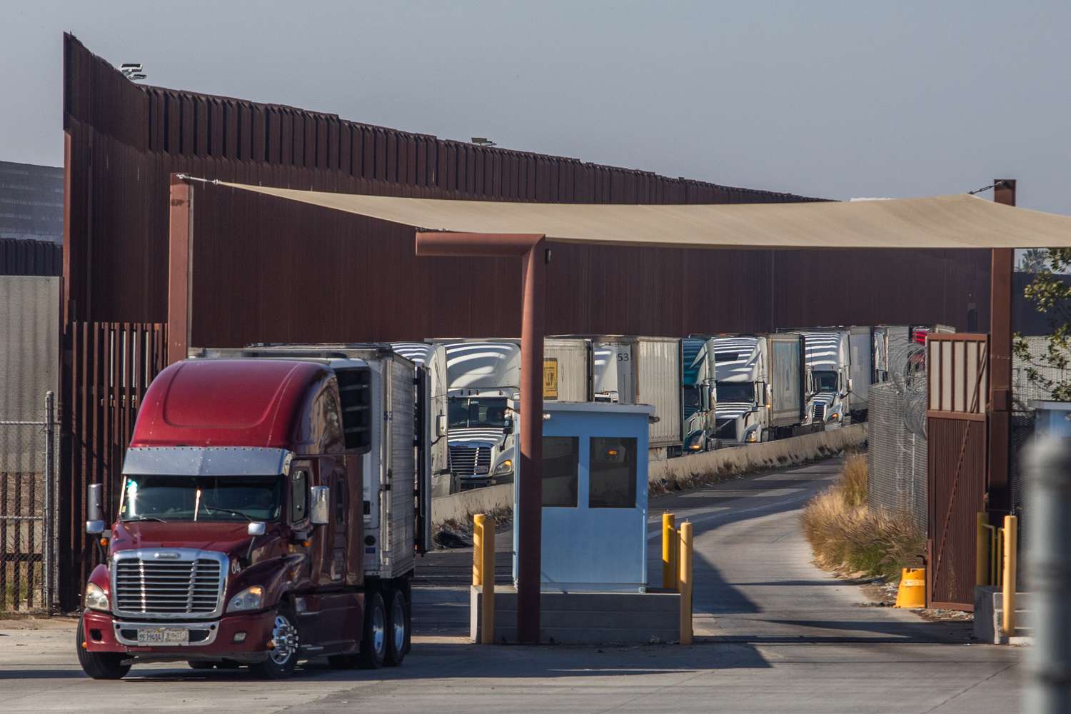 Trucks line-up to drive into Mexico at the Otay Mesa Port of Entry, on the U.S.-Mexico border on February 1, 2025 in San Diego, California. 