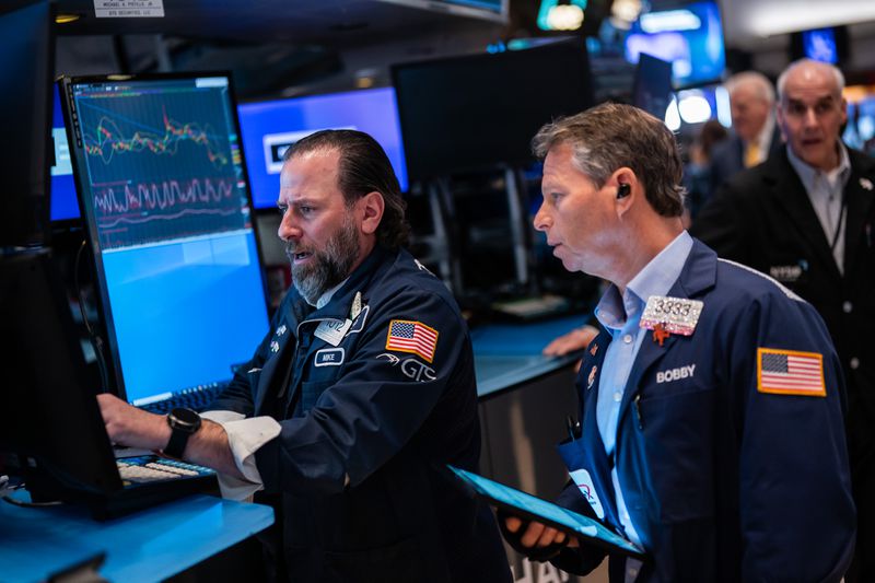 Traders work on the floor of the New York Stock Exchange