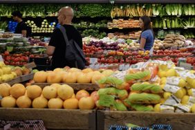 Customers shop for fruit at a supermarket in Manhattan on July 11, 2024 in New York City