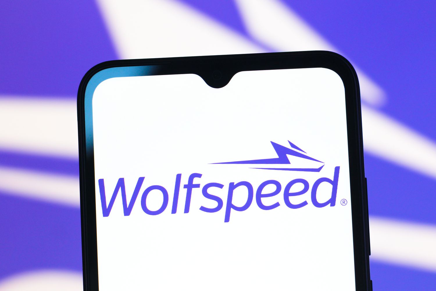 The Wolfspeed logo is seen displayed on a smartphone screen