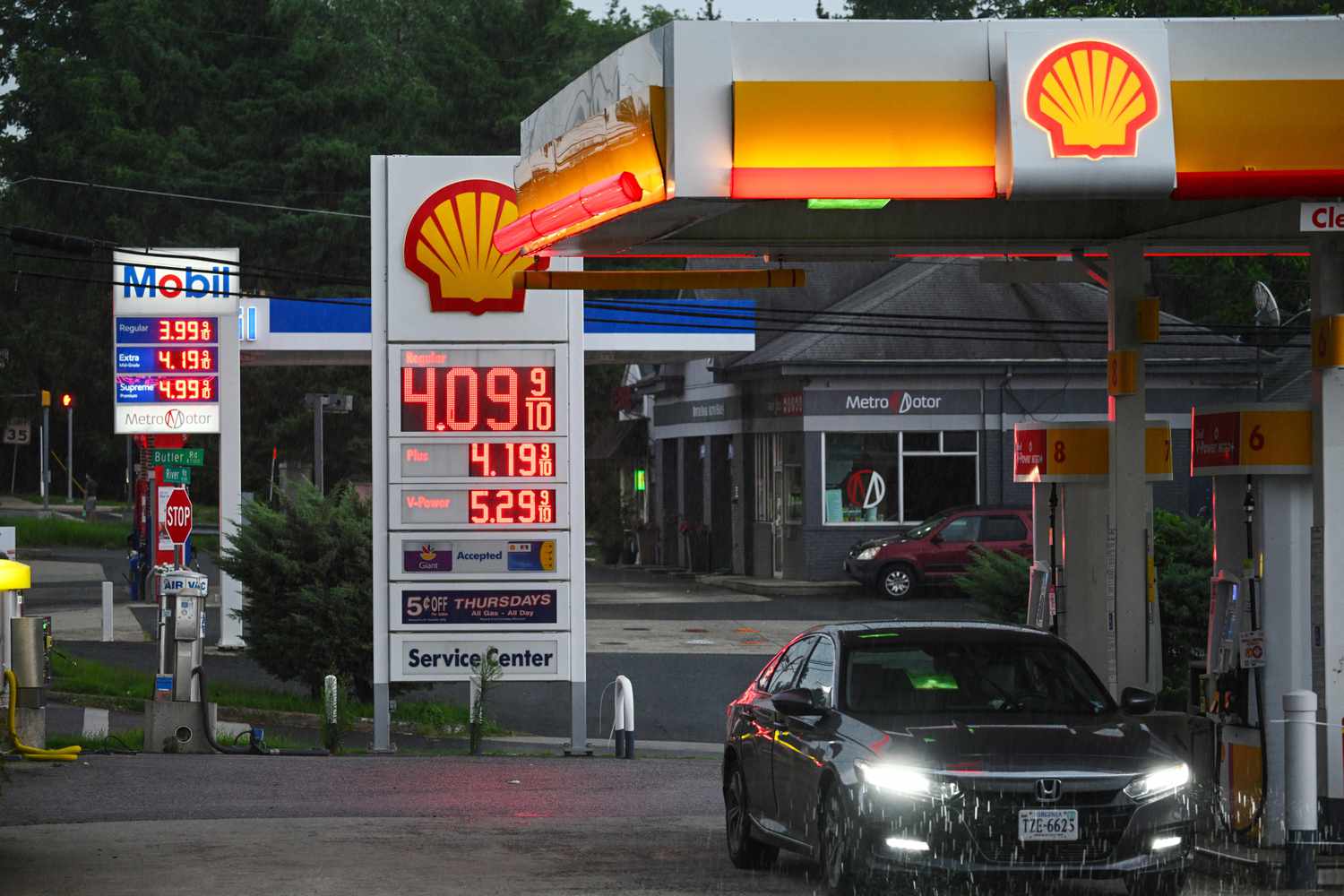 Gas station signboards display prices in Bethesda, Maryland, on Aug. 6, 2023. The American Automobile Association's average price for a gallon of regular gasoline is $3.829, up from $3.331 on January 2, 2023. 