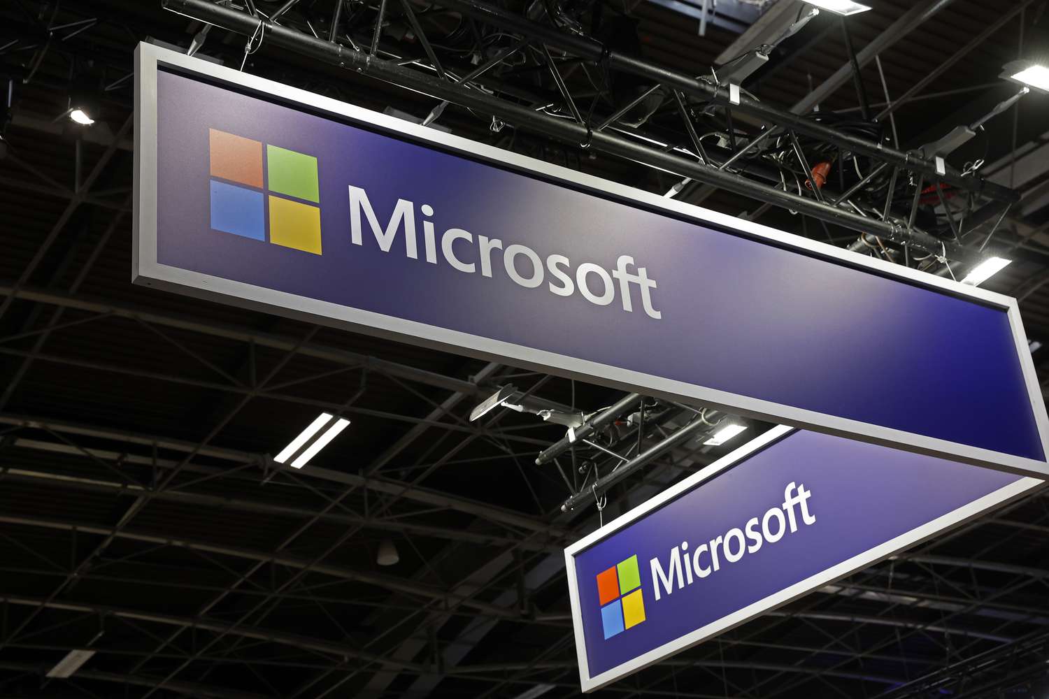 The Microsoft logo on display at a conference.