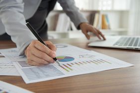 An investor compares the portfolio holdings of two mutual funds to determine if they are substantially identical securities.