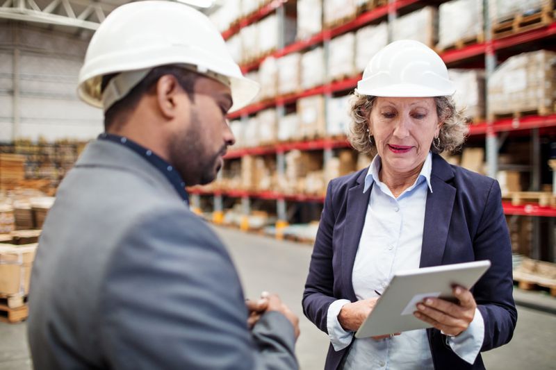 Warehouse manager meeting with supervisor