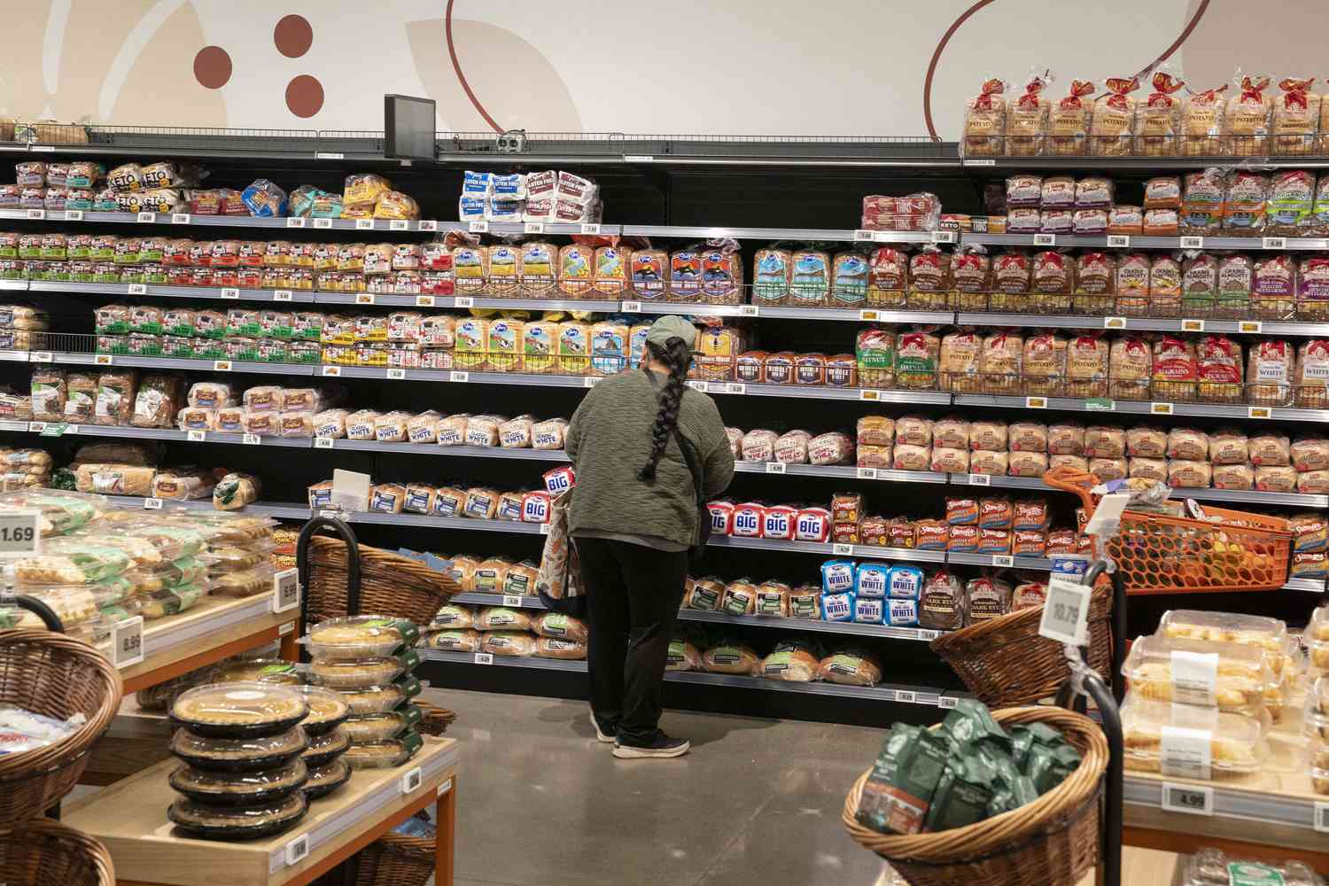 A person shops for bread at an Amazon Fresh grocery store on December 12, 2024 in Federal Way, Washington. 