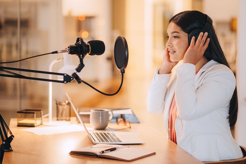 Podcast studio, woman and checking headphones for broadcast media entertainment preparation