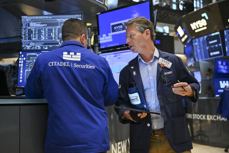 Traders work on the floor of the New York Stock Exchange (NYSE) at the opening bell on June 2, 2025, in New York City. 